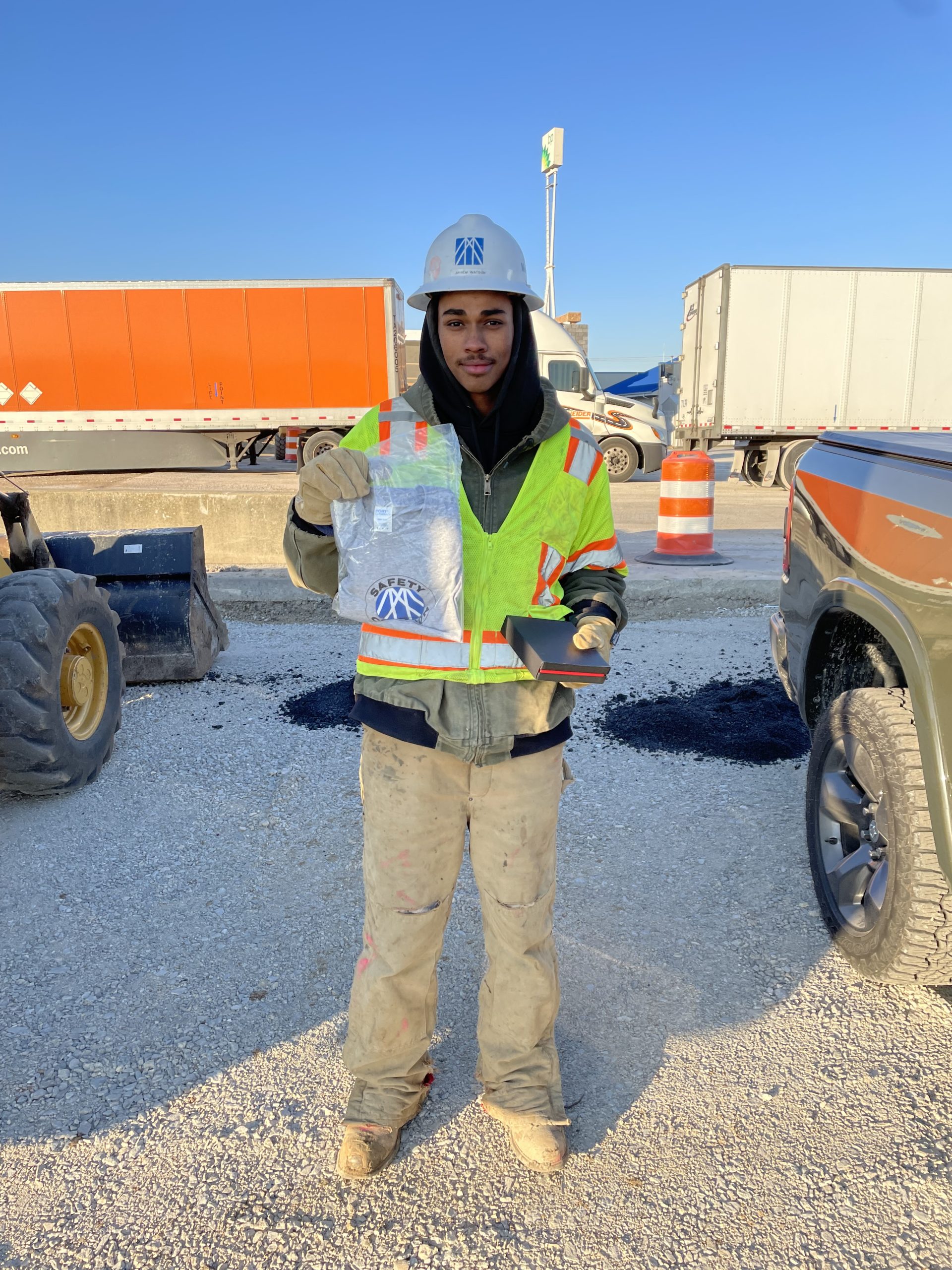 safety champion holding gifts