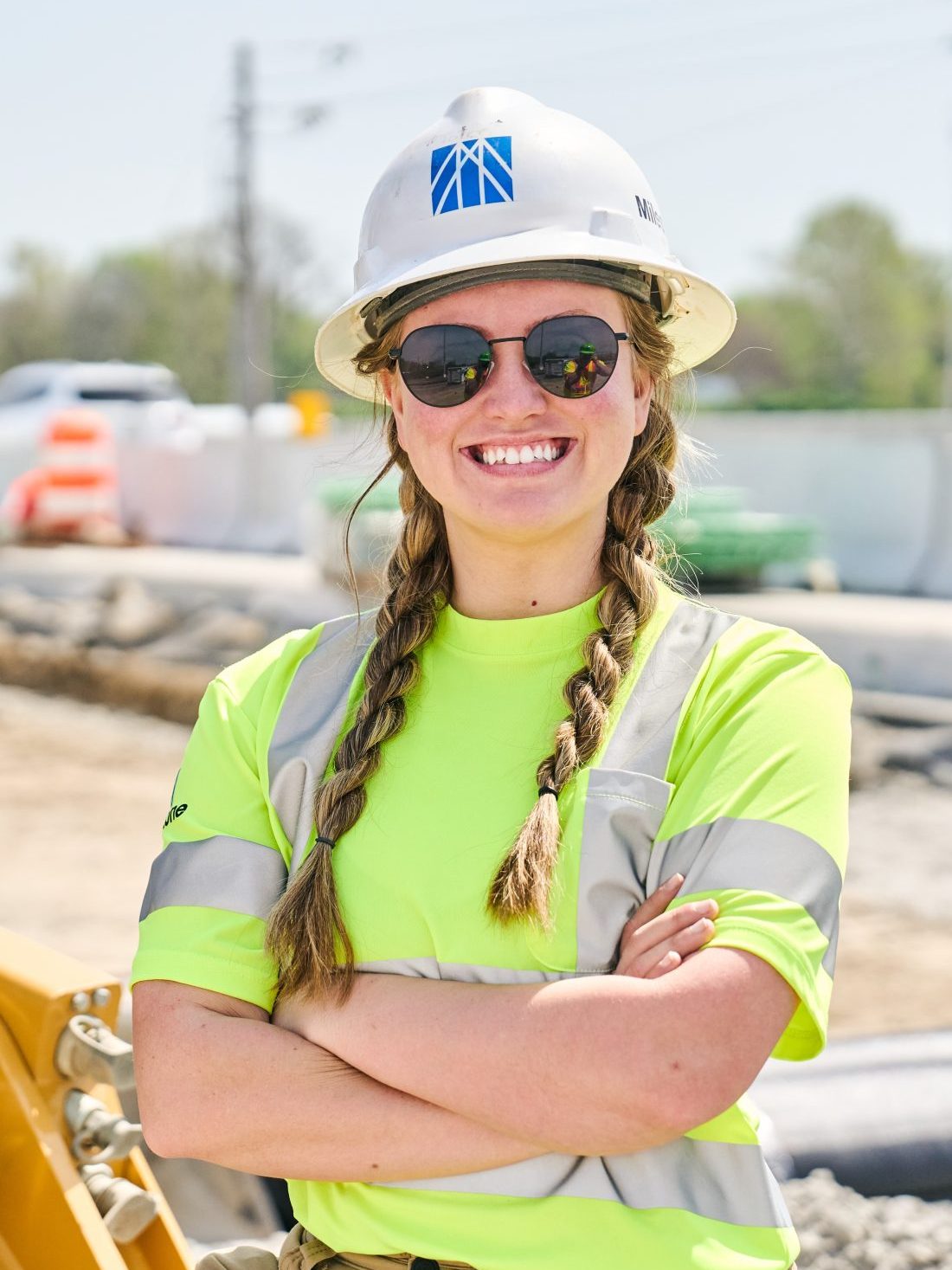 young female construction worker posing on a jobsite