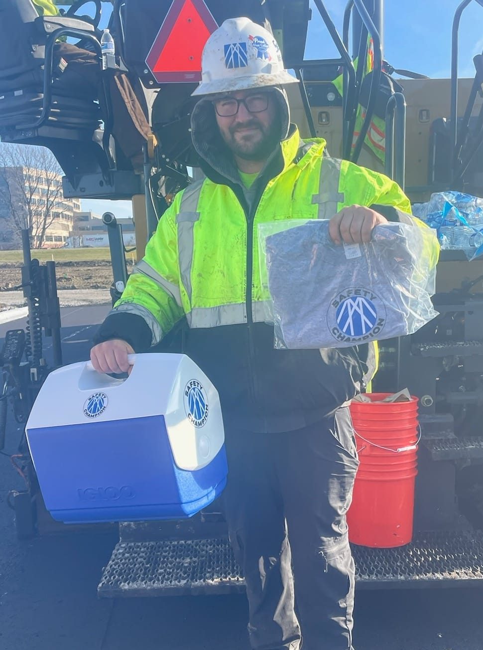 Safety champion holding gifts