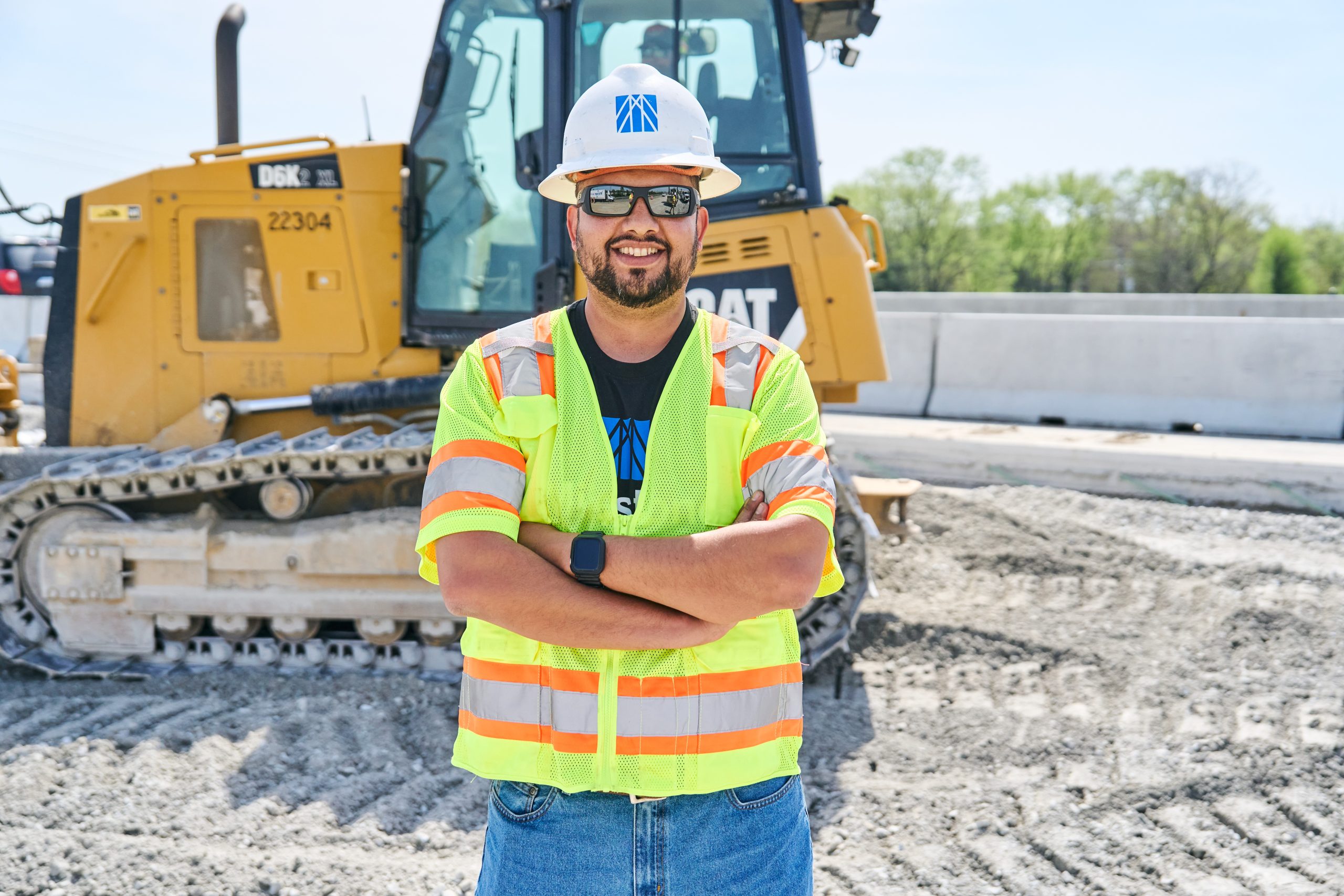 construction worker in front of heavy equipment