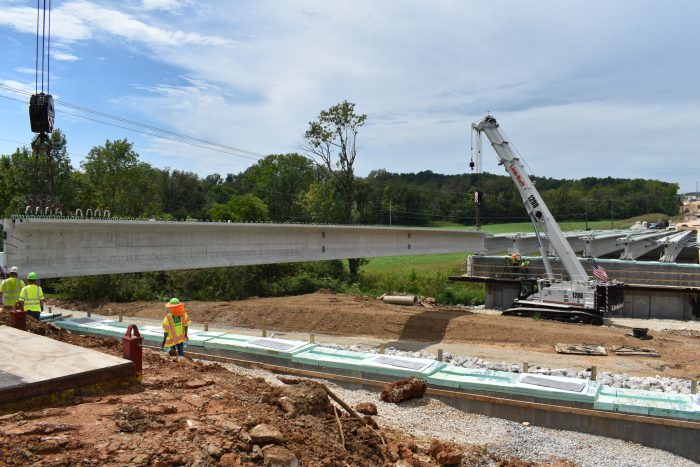 Milestone team and crane set the beams