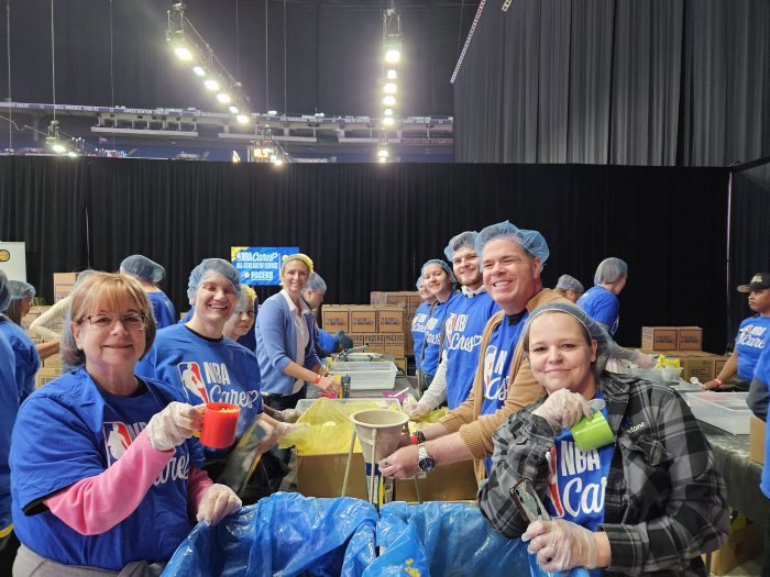 Milestone Team packing meals at NBA Cares Day.